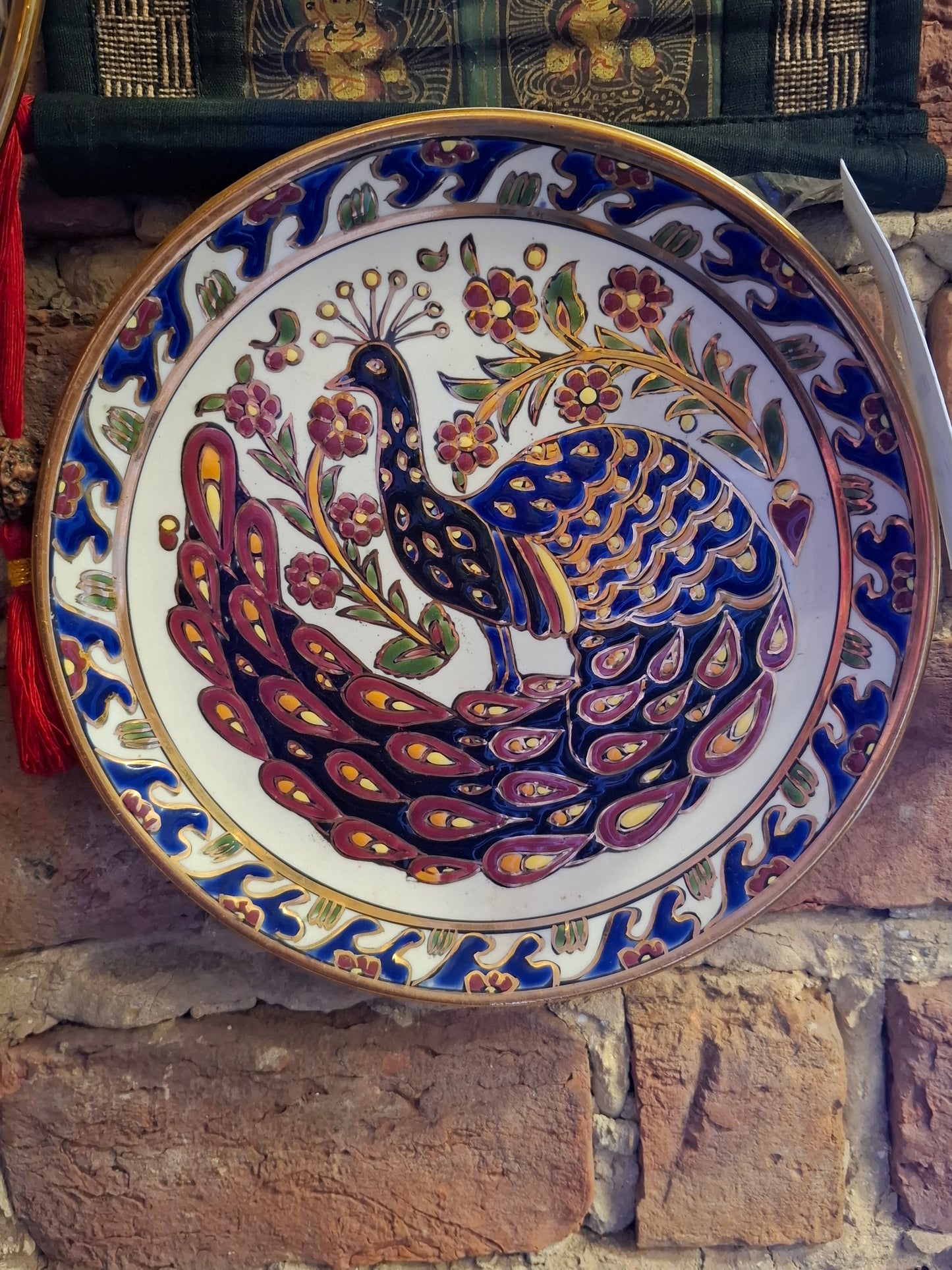 Dekorativer Pfauen-Wandteller