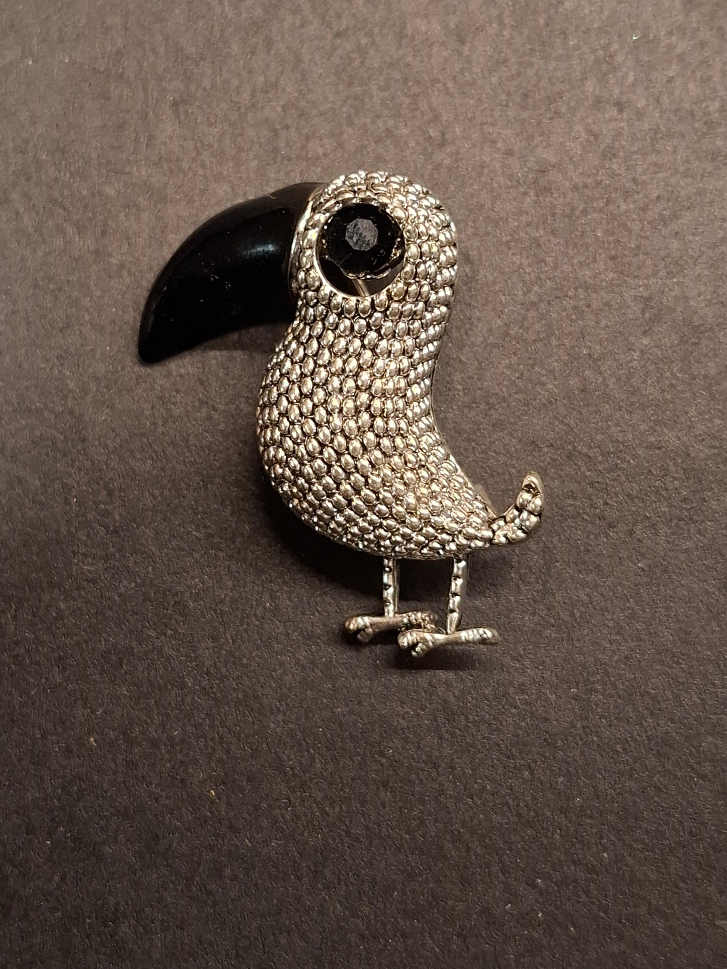 Tukan Brosche